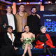 The cast of West Side Story, including (on the couch), Ariana DeBose, Rachel Zegler, and Rita Moreno.